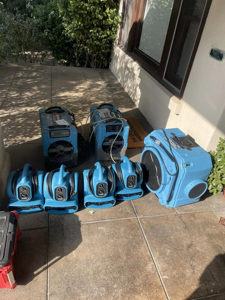 Air movers and air scrubber staged for deployment on a Bay Area loss